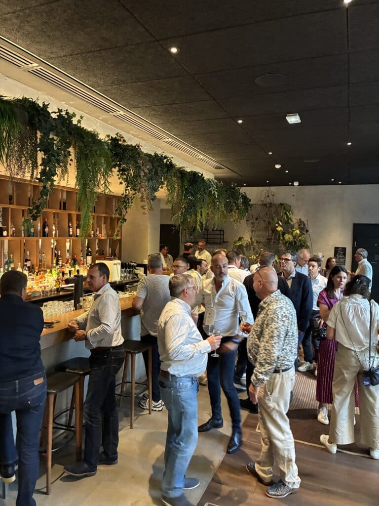 Business partners exchanging ideas at the NRF Europe 2026 industry event